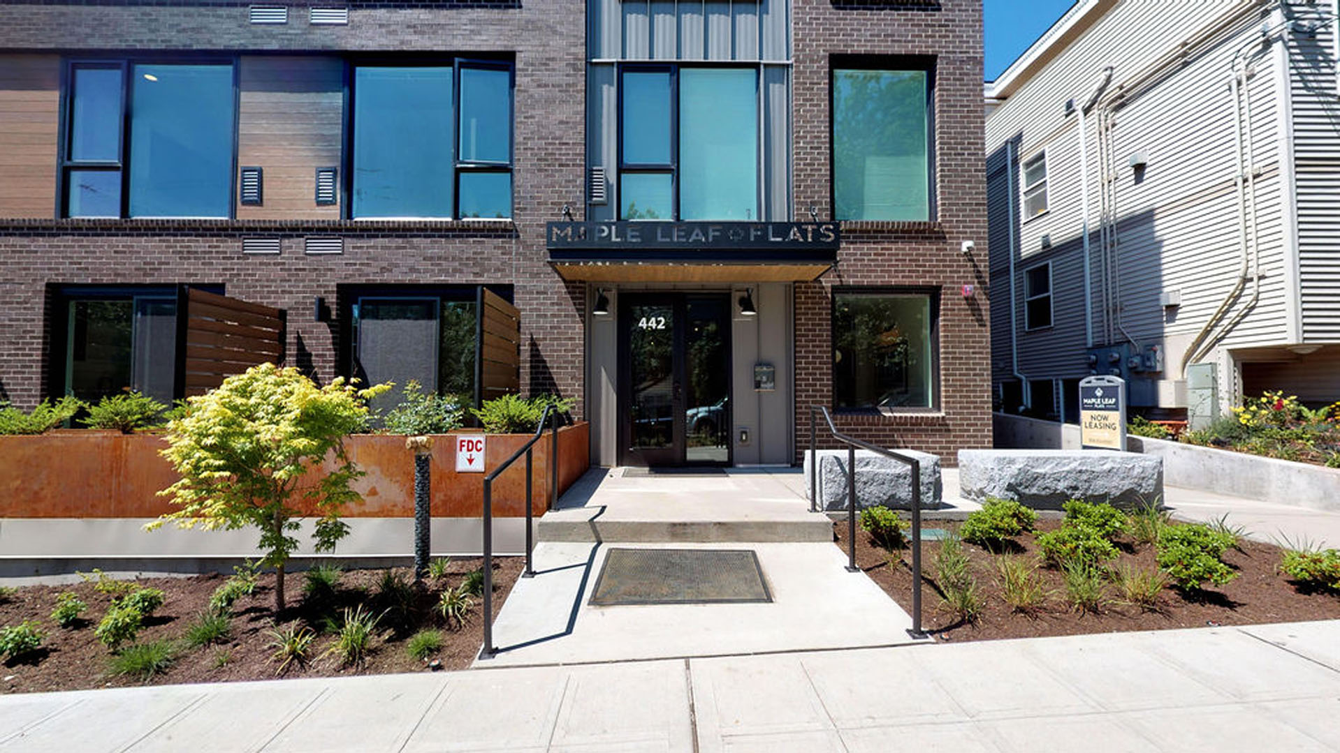 MapleLeafFlatsStudioUnit402sqftFrontOfBuilding Maple Leaf Flats